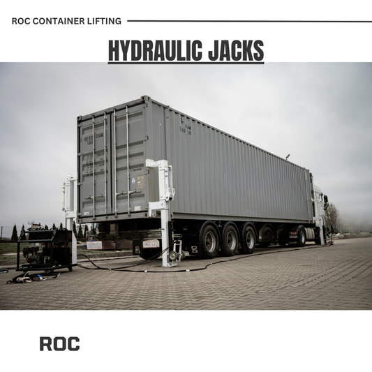 Truck lifting a large container with hydraulic jacks.